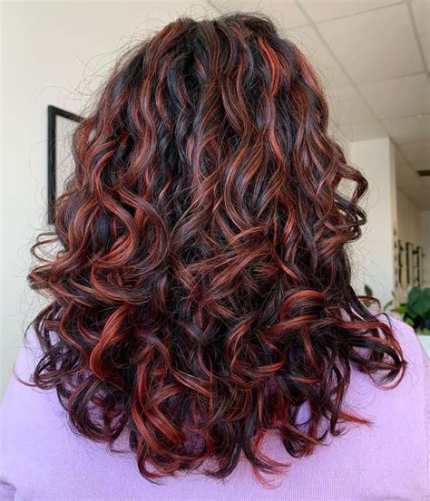 dark red highlights curly hair